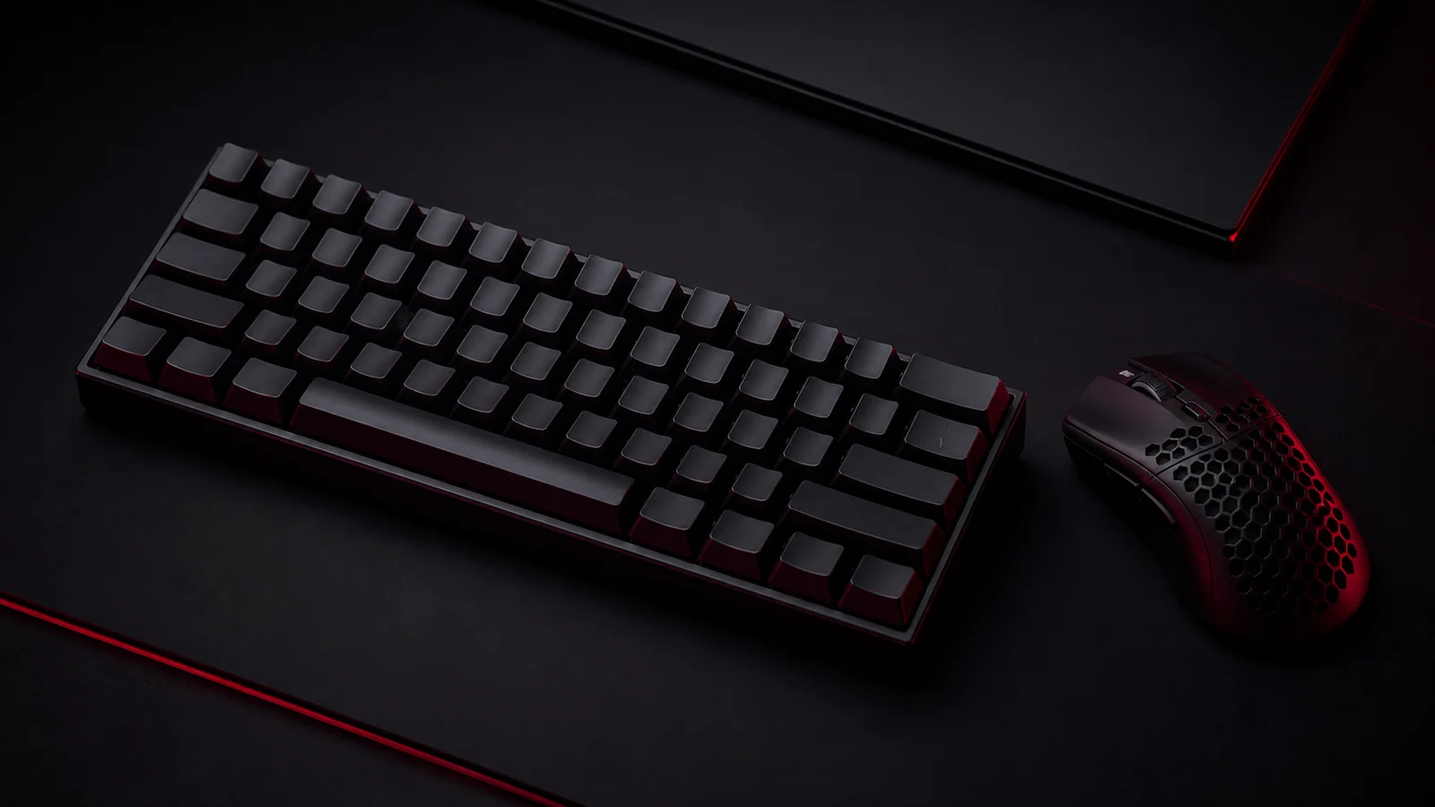 An unbranded compact mechanical gaming keyboard beside a gaming mouse